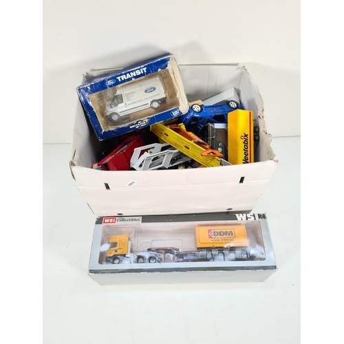 309A - A large collection of assorted diecast model vehicles to include Bburago ford Escort RS Cosworth, Co... 