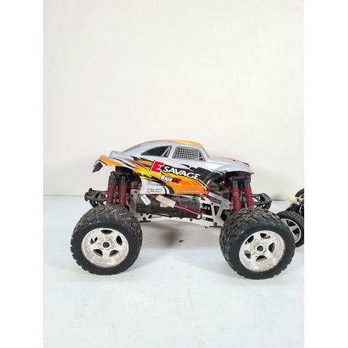 310 - Two battery operated remote control cars, one HPI Racing E Savage and one Maverick Strada XB with Ni... 