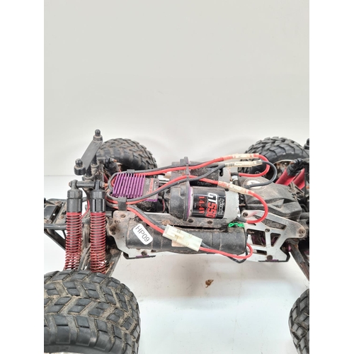 310 - Two battery operated remote control cars, one HPI Racing E Savage and one Maverick Strada XB with Ni... 