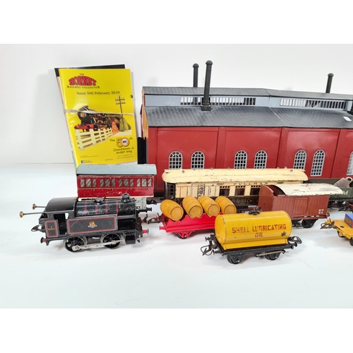 315 - A collection of mid 20th century Hornby tinplate O gauge railway models and accessories to include B... 