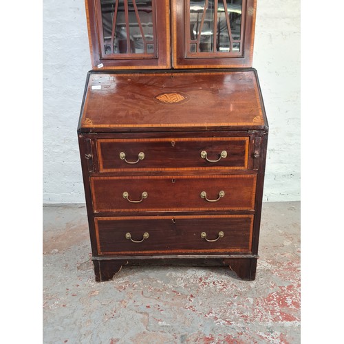 1004A - An Edwardian inlaid mahogany bureau bookcase with shell and fan inlay, upper swan neck pediment, two... 