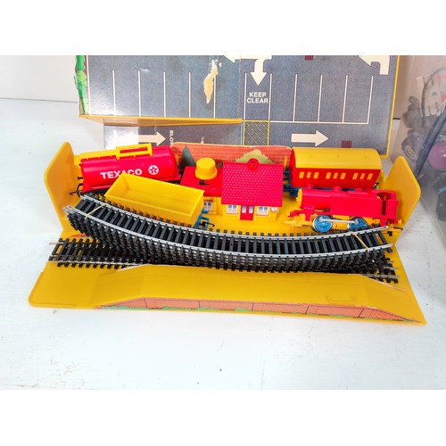 305 - A collection of assorted toys to include cased Hornby battery operated train set with track, train a... 