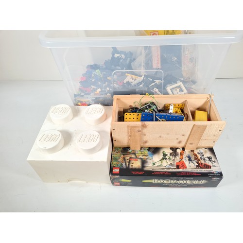 311 - A large collection of assorted Lego and Meccano model building parts with instruction manuals and st... 