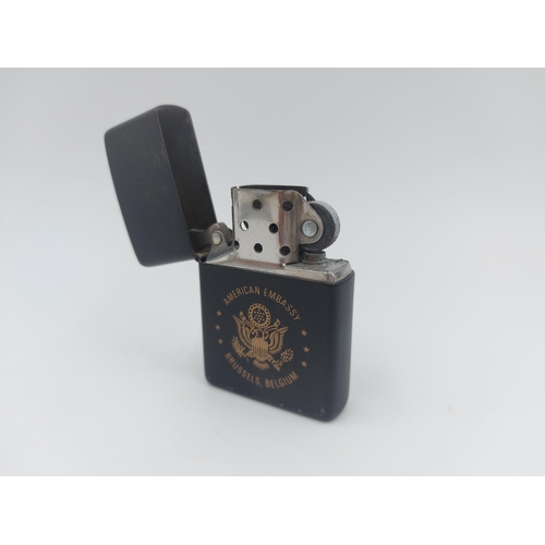 211A - Three assorted Zippo cigarette lighters, Iceland Defense Force, American Embassy Brussels Belgium an... 