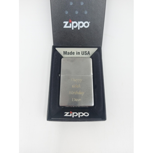 211B - Two Zippo cigarette lighters, boxed Windproof engraved Happy 65th Birthday Dave and Royal Air Force