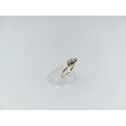 56 - A hallmarked 9ct gold diamond trilogy bypass ring, size L ½ - approx. gross weight 1.61 grams