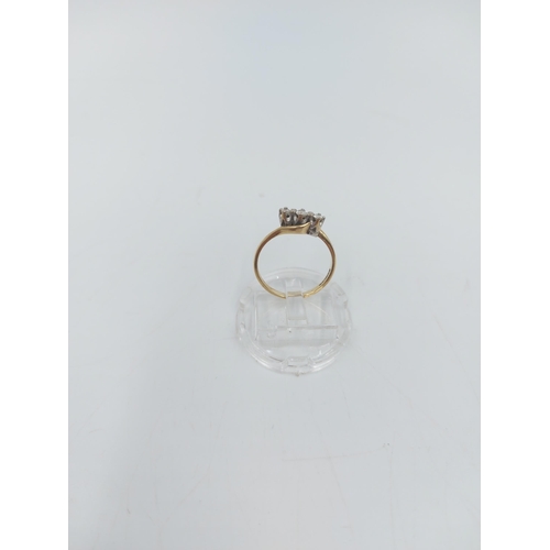 56 - A hallmarked 9ct gold diamond trilogy bypass ring, size L ½ - approx. gross weight 1.61 grams