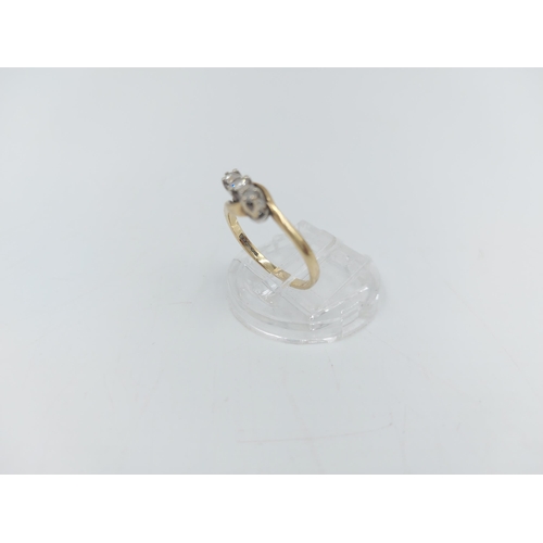 56 - A hallmarked 9ct gold diamond trilogy bypass ring, size L ½ - approx. gross weight 1.61 grams