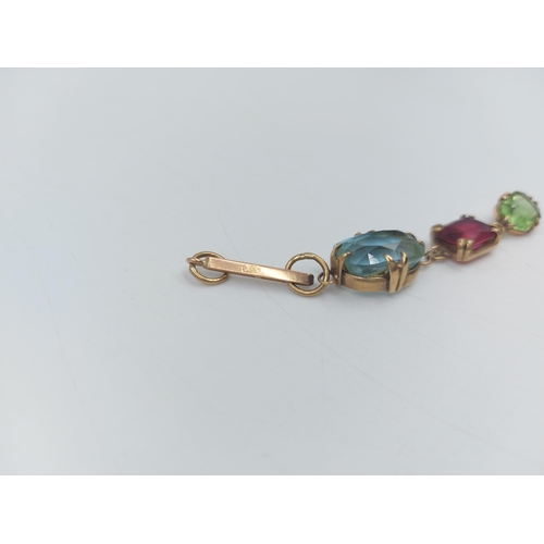 67 - A stamped 9ct gold aquamarine, ruby and emerald paste droplet necklace pendant - approx. gross weigh... 