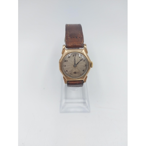 95 - An Art Deco men's hallmarked 9ct gold cased wristwatch with silvered face, sub second dial at six an... 