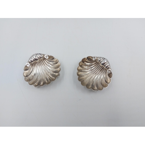 159 - A cased pair of hallmarked Chester silver scallop shell shaped salts, dated 1895 - approx. gross wei... 