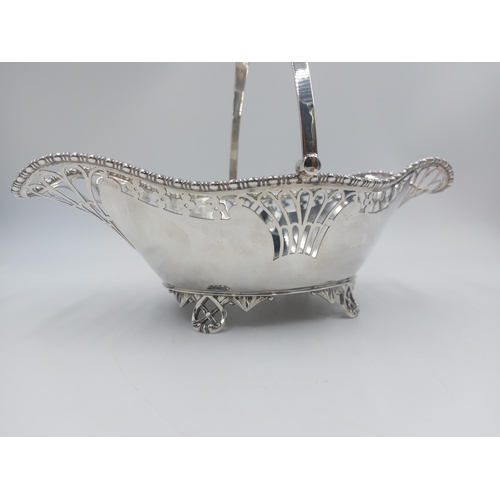 162 - A hallmarked Sheffield silver Martin Hall & Co pierced handled footed basket, dated 1918 - gross app... 