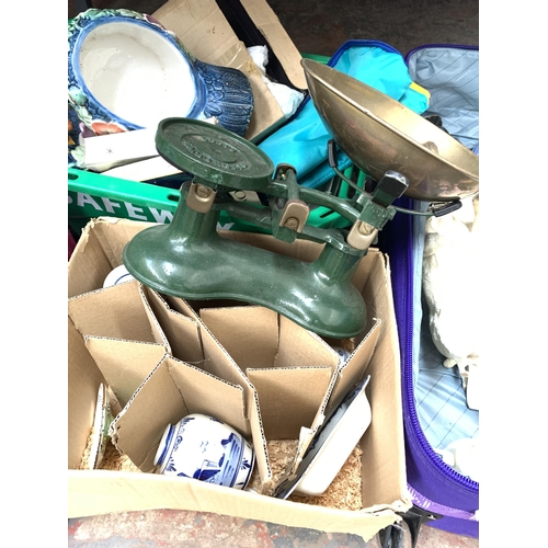 1425 - Four boxes and one suitcase containing boots, set of vintage Boots green cast iron kitchen scales wi... 