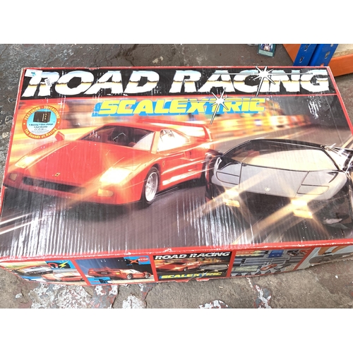 1427 - Three items, one boxed 1/18 scale Ford GT die-cast model car, classic Scalextric track with transfor... 