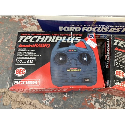 1427A - Three items, two boxed Asahi Techniplus remote control units and one Tamir Ford Focus RS WRC 01 box ... 