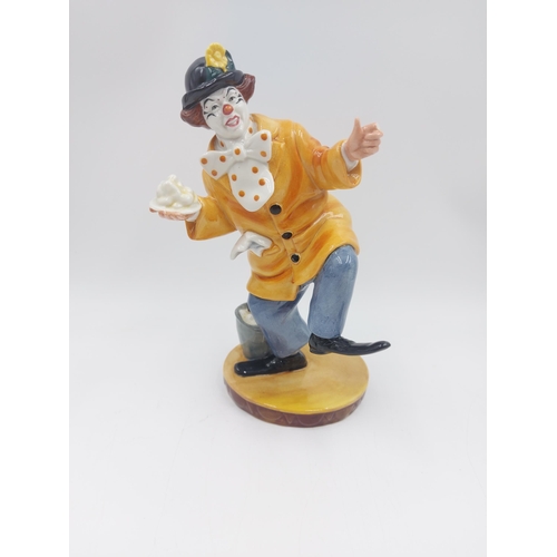 239 - Two Royal Doulton figurines, The Clown - HN 2890 and The Master - HN 2325