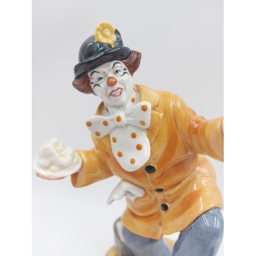 239 - Two Royal Doulton figurines, The Clown - HN 2890 and The Master - HN 2325