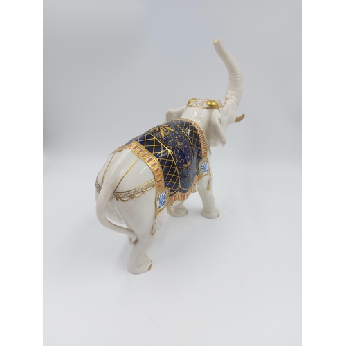 241 - A vintage German porcelain elephant figurine with 'S' makers mark to base - approx. 24cm high x 26cm... 