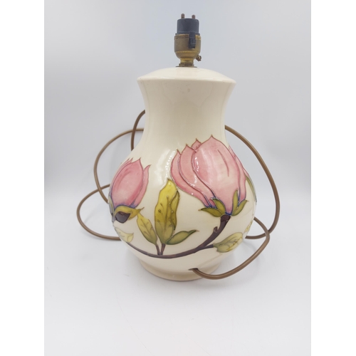 243 - A Moorcroft Pottery table lamp in the Pink Magnolia design - approx. 30.5cm high