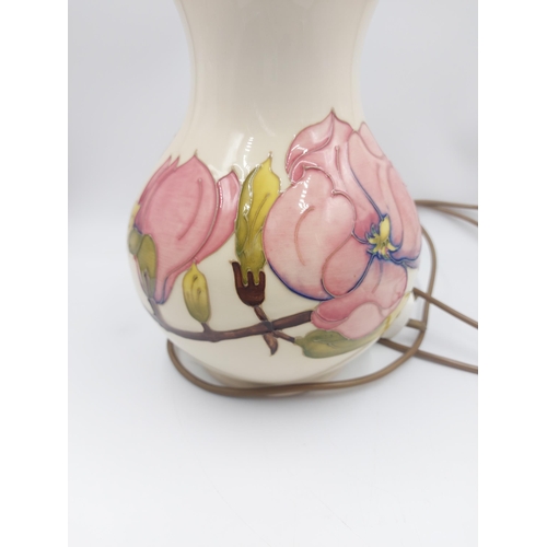 243 - A Moorcroft Pottery table lamp in the Pink Magnolia design - approx. 30.5cm high