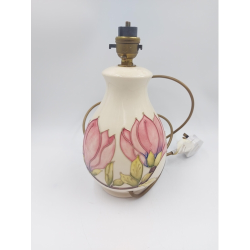 244 - A Moorcroft Pottery table lamp in the Pink Magnolia design - approx. 25cm high