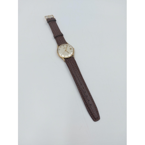 90A - A late 1960s/early 70s Omega 9ct gold automatic wristwatch with brown leather strap - approx. gross ... 