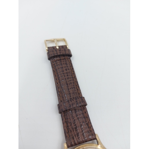 90A - A late 1960s/early 70s Omega 9ct gold automatic wristwatch with brown leather strap - approx. gross ... 