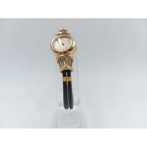 90B - A vintage Jaeger-LeCoultre 9ct gold cased backwind wristwatch with black strap