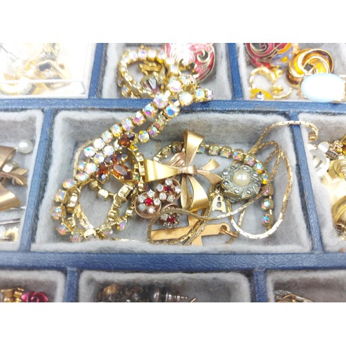 69G - A box containing assorted costume jewellery to include vintage Miracle agate brooch, vintage Bentima... 