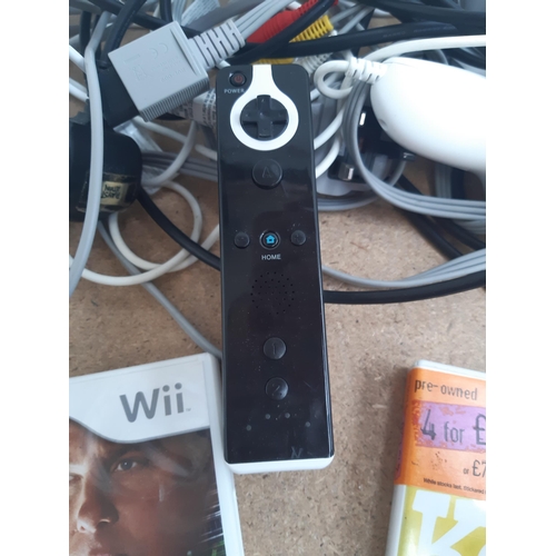 1148 - A collection of Nintendo Wii items to include two white RVL-001 consoles, stand, Classic Controller,... 