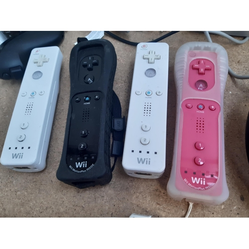 1149 - A collection of Nintendo Wii items to include two white RVL-001 consoles, black RVL-001 console, fou... 