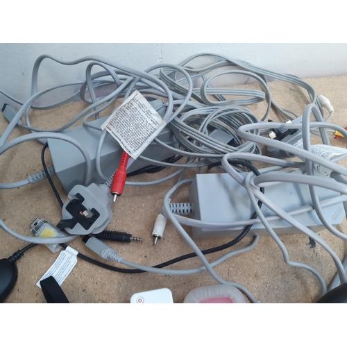 1149 - A collection of Nintendo Wii items to include two white RVL-001 consoles, black RVL-001 console, fou... 