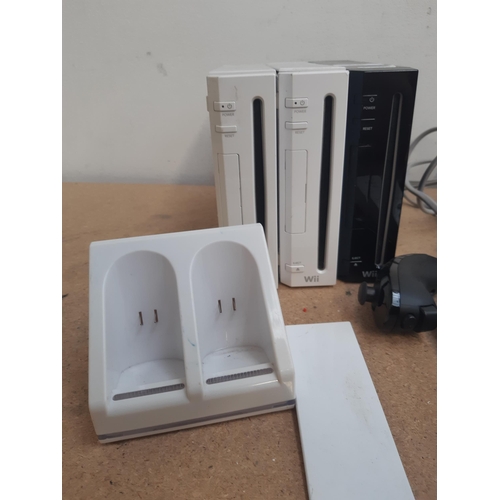 1149 - A collection of Nintendo Wii items to include two white RVL-001 consoles, black RVL-001 console, fou... 