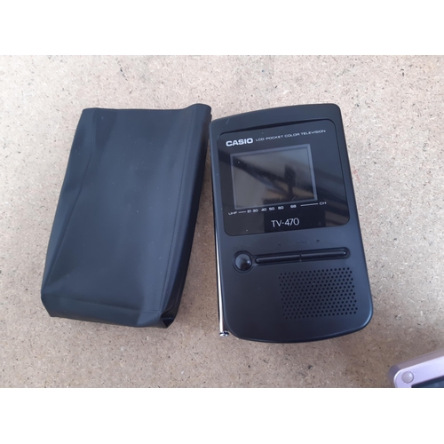 1151 - A box containing cased Archos AV700 mobile DVR, cased Casio TV-470 LCD pocket colour TV, three Ninte... 