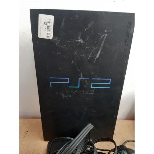 1152 - A collection of Sony PlayStation items to include SCPH-70003 console, SCPH-30003 console, controller... 