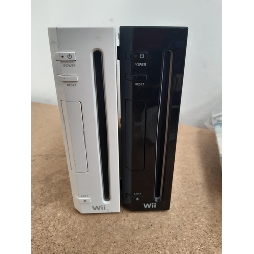 1154 - A collection of Nintendo Wii items to include black RVL-001 console, white RVL-001 console, Wii remo... 