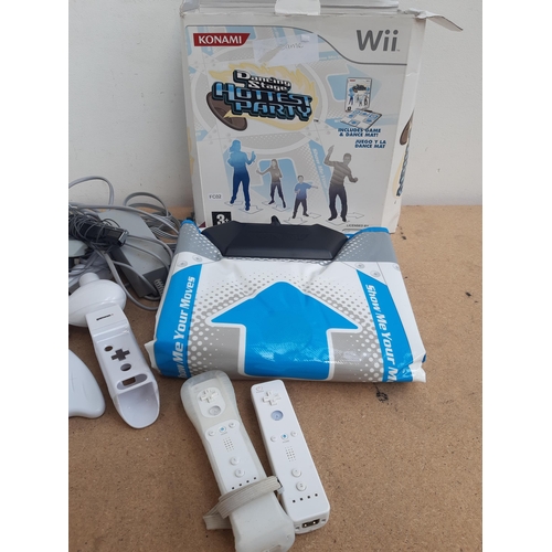 1155 - A collection of Nintendo Wii items to include two white RVL-001 consoles, boxed Dancing Stage mat, W... 