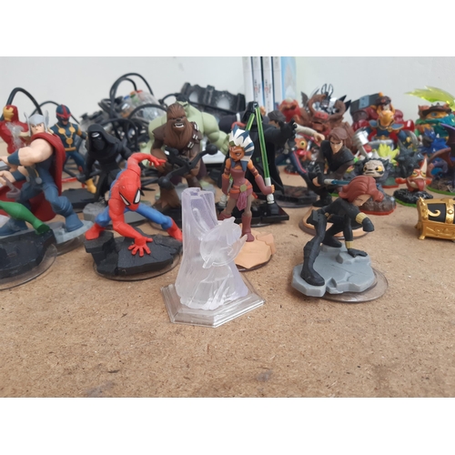 1161 - A collection of console gaming accessories and figures to include Skylanders, Star Wars and Marvel f... 