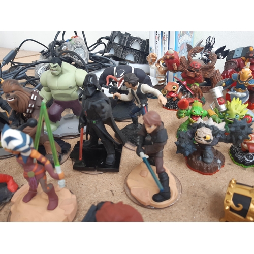 1161 - A collection of console gaming accessories and figures to include Skylanders, Star Wars and Marvel f... 