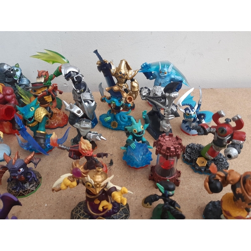 1161 - A collection of console gaming accessories and figures to include Skylanders, Star Wars and Marvel f... 