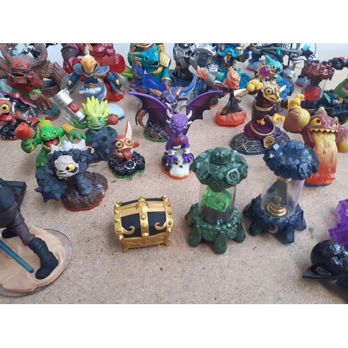 1161 - A collection of console gaming accessories and figures to include Skylanders, Star Wars and Marvel f... 