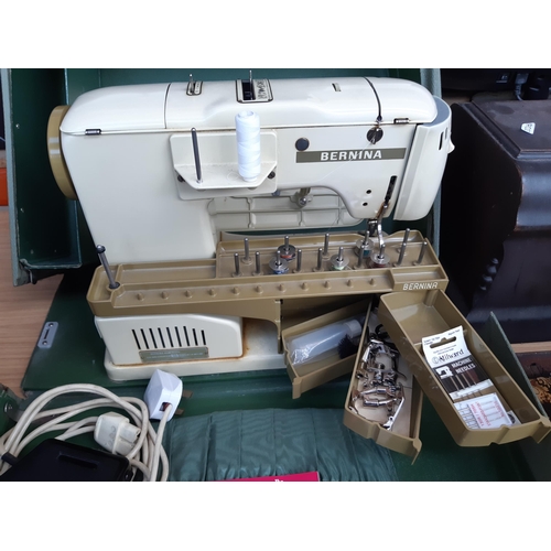 1189 - Two cased sewing machines, one vintage green and cream Bernina Record electric with foot pedal and i... 