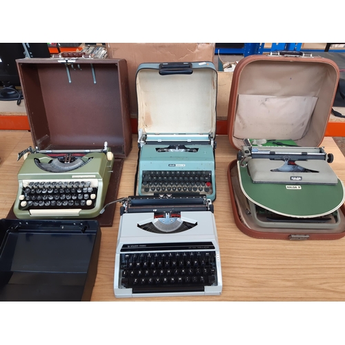 1191 - Four vintage cased portable typewriters, one green Olivetti Lettera 32, one green Halda of Sweden wi... 