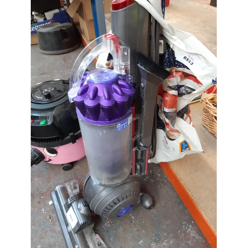 1193 - A purple and grey Dyson DC40 ball technology upright bagless vacuum cleaner with attachments