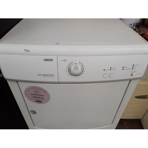 1202 - A Zanussi ZDC37200W 7kg reverse action tumble dryer