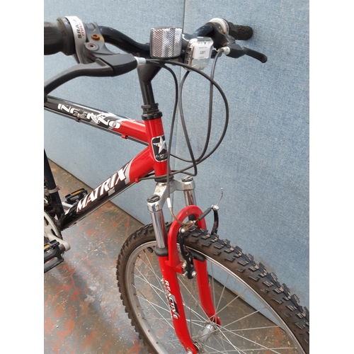 1207 - A black and red Matrix Inferno gent's mountain bike with front suspension and eighteen speed Shimano... 