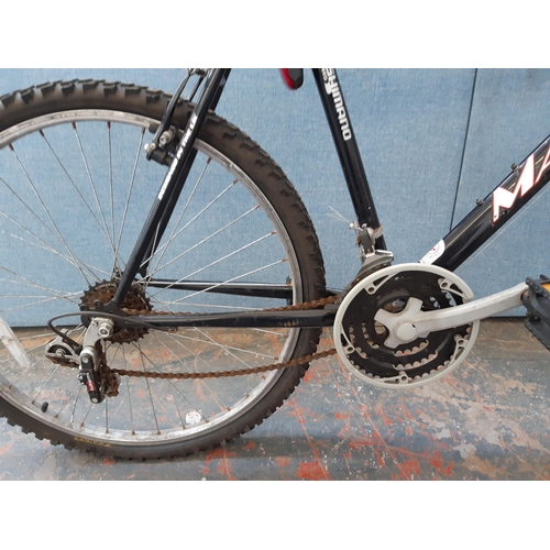 1207 - A black and red Matrix Inferno gent's mountain bike with front suspension and eighteen speed Shimano... 