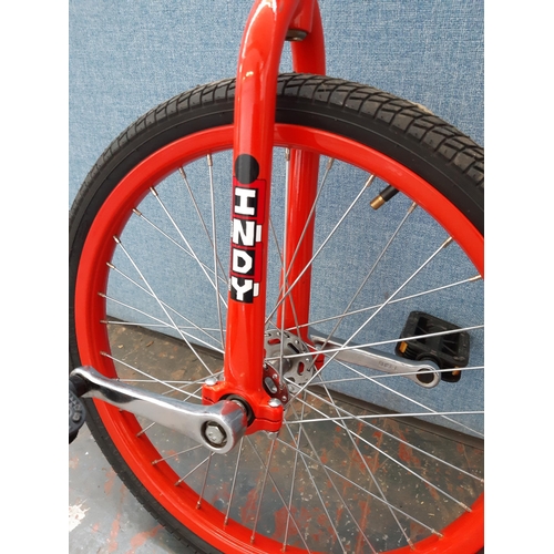 1214 - A red Indy unicycle