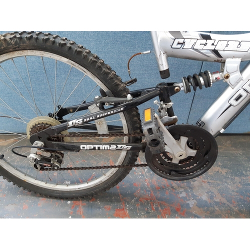 1216 - A grey Optima Cyclone dual suspension mountain bike with eighteen speed Shimano gear system