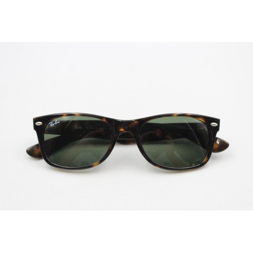 215 - A pair of cased classic Ray-Ban Wayfarer tortoiseshell effect sunglasses